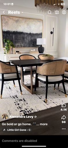 a dining room table with chairs and a chandelier