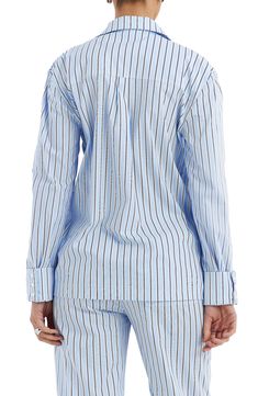 A lightweight cotton-blend design lends versatile style to this boxy-fit button-up covered in smart stripes. Front button closure Spread collar Long sleeves with button cuffs 70% cotton, 27% polyamide, 3% elastane Dry clean Imported Blue Cotton Shirt With Striped Cuffs, Relaxed Fit Button-up Top With Striped Cuffs, Relaxed Fit Striped Cuff Button-up Top, Button-up Tops With Striped Cuffs For Daywear, Pinstripe Cotton Button-up Blouse, Cotton Shirt With Striped Cuffs And Relaxed Fit, Striped Button-up Tops For Loungewear, Vertical Stripes Button-up Tops For Daywear, Blue Tops With Striped Cuffs In Relaxed Fit