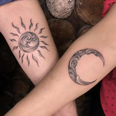 two people with matching tattoos on their legs, one has a sun and the other has a crescent moon