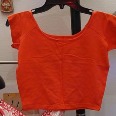 Bright Coral Hot Pink Short Sleeve Crop Top. Tight Fit. Super Cute For Summer. Brand New Never Worn. Spring Orange Stretch Tops, Orange Cotton Workout Top, Orange Short Sleeve Workout Top, Orange Stretch Crop Top With Short Sleeves, Casual Workout Tops In Orange, Casual Orange Workout Tops, Casual Workout Orange Tops, Orange Stretch Summer Tops, Orange Stretch Cotton Tops