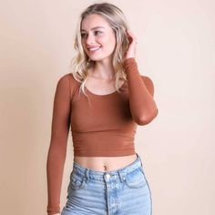 Long Sleeve Fit Crop Top In A Pretty Copper Tone. Is A Stretchy 92% Nylon And 8% Spandex Blend. Comes In Xs/S And M/L Xs/S: 32a, 32b, 32c, 34a, 34b M/L: 32d, 34c, 36b, 36c, 38b Black Currently Out Of Stock. Leave A Comment Below To Request Restocking It. Fall Crop Top With Scoop Neck And Stretch Fit, Fall Stretch Crop Top With Scoop Neck, Fall Season Stretch Scoop Neck Crop Top, Versatile Stretch Crop Top For Fall, Fitted Brown Basic Crop Top, Brown Fitted Crop Top For Everyday, Fitted Brown Crop Top For Everyday, Crop Top Long Sleeve, Workout Crop Top