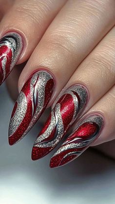 Wow at homecoming with Crimson and Silver Swirls on your nails! This striking design combines bold color with elegant shimmer for a standout look. Click the pin and follow us for more eye-catching nail inspirations! #CrimsonAndSilver #HomecomingNails #NailArt #SwirlNails #BoldDesigns