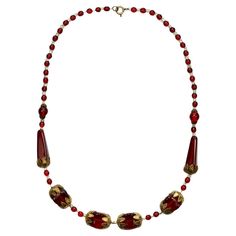 Wonderful ornate gold tone necklace, featuring red and clear glass beads. Measuring necklace length 46.2 cm / 18.1 inches. The necklace is all original and is probably Czech. This beautiful red glass necklace is circa 1930s. Gold Tone Necklace, Glass Necklace, Red Glass, Necklace Length, The Necklace, Clear Glass, Necklace Lengths, Glass Beads, Gold Tones