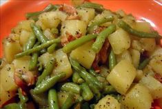 a close up of a plate of food with potatoes and green beans