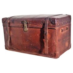 an old brown leather trunk is shown on a white background