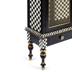 a black and white checkered cabinet with gold trim