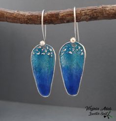 "Want something for a different look during the day? These Dangle Earrings with Ocean Blue Enamel will add a unique look to an outfit. The handmade 925 Silver Earrings are made of sterling silver and Turquoise blue enamel. These long blue Earrings are perfect to wear for any opportunity and also light. Details: Weight: 3 g each one Width: 13 mm = 0.51\" Length: 30 mm = 1.18\" Enjoy and thanks for looking! Follow me: www.facebook.com/jewelersoul Visit my shop for a matching also pendants: https:/ Artistic Blue Nickel-free Jewelry, Handmade Artistic Blue Earrings, Unique Blue Sterling Silver Earrings, Blue Drop Earrings Pierced, Artistic Blue Sterling Silver Earrings, Handmade Blue Sterling Silver Earrings, Unique Blue Drop Earrings, Unique Blue Earrings, Unique Blue Hypoallergenic Earrings