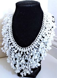 A handmade glass seed beaded necklace that is perfect for any occasion: parties, weddings, holidays, birthdays, anniversaries. All products are hand-crafted by my mother. Dimensions: - Collar Length: 20.5 cm - Actual Length: 29.0 cm - Width: 17.5 cm - Height: 7.0 mm Lightweight, high quality with a beaded hook as a clasp.  Acrylic Pearls: 8 mm. Will respond to concerns and suggestions promptly. Shipping costs: Free Domestic Shipping. All orders are sent by air-mail with tracking number. Time of delivery: Estimated 1-3 days for domestic shipping; international make take 7-14 days. Feel free to check out our other similar products! Link: https://noorsjewelers.etsy.com White Necklaces With Colorful Beads For Party, Wedding Pearl Beaded Chain Beads, Wedding Pearl Beaded Chain, White Beaded Necklaces For Wedding, White Beaded Necklace For Party, White Large Beads Necklace For Wedding, Pearl Beaded Necklace With Colorful Beads For Weddings, White Polished Bead Necklaces For Party, White Beaded Chain Necklace For Celebration