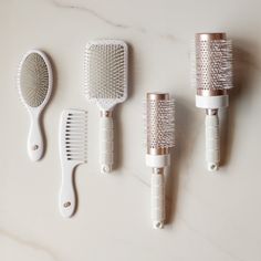 Never underestimate the power of a good hairbrush. The Ultimate Brush Set is a must-have staple for daily styling and touchups. You’ll use them. You’ll love them. You’ll thank us. The Ultimate Brush Set includes: T3 Smooth Paddle Brush, T3 Volume 2.5" Round Brush, T3 Volume 3" Round Brush, and T3 Detangle Duo: Wide tooth comb + Detangle brush. | T3 Pro Brush Collection Classic 5 Hairbrush Collection, White Detangle Brush, Curling Techniques, Hair Dryer Set, Hair Dryer Accessories, Rotating Curling Iron, Curling Tools, Shower Head Filter, Barrel Curling Iron, Hair Diffuser