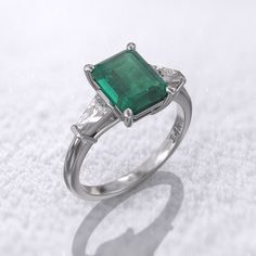 Art deco emerald engagement ring 2-carat Colombian emerald lab-grown 8.5x6.5mm & 2 Sided Moissanite baguette tapered MORE INFORMATION ❥ The craft period is about 5-7 business days. ❥ Free shipping via DHL ❥ Available in a combination of 14K Rose Gold, 14K Yellow Gold, 14K White Gold ❥ Arrives in our box, ready for gift-giving (and proposing ) ❥ GioielliRings engagement ring : Gem Type- lab-grown Colombian emerald Weight-2 ct (approx) Size- 8.5x6.5mm Color- Green Clarity- Cut(Shape): Brillian Trapezoid Side Stones, Emerald Three Stone Ring, Engagement Ring 2 Carat, Art Deco Emerald, Emerald Cut Engagement Ring, Emerald Cut Engagement, Gold Solitaire Ring, Emerald Engagement Ring Cut, Colombian Emeralds