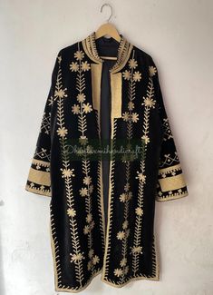 Hand-Embroidered Cotton Velvet Long Coat, Suzani Fabric Unisex Jacket, Kimono Style Coat, Party Wear Jacket, Overcoat, Velvet Fabric Coat, Please MESSAGE us for CUSTOM ORDERS  Product: 100% Cotton Velvet Embroidery Long Jacket Coat Measurements :   Length- 46 Inches /116 CM   Bust-50 inches / 127 CM   Sleeve-24 inches / 60 CM Size: Free Size Robe ( S to XXL )  Cotton kimono robes are perfect for lounging around the home or spa. Versatile, soft and luxurious. Add a luxe, boho feel to your bridal Traditional Black Outerwear With Chikankari Embroidery, Black Outerwear With Resham Embroidery For Winter, Festive Black Outerwear With Floral Embroidery, Fall Festive Outerwear With Gold Embroidery, Festive Fall Outerwear With Gold Embroidery, Long Winter Outerwear With Chikankari Embroidery, Fitted Winter Outerwear With Dabka Work, Festive Embroidered Long Coat Outerwear, Embroidered Long Coat For Festive Occasions