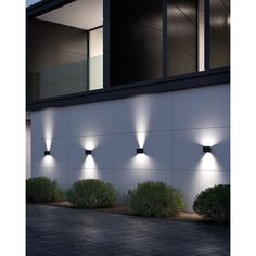 four lights on the side of a building