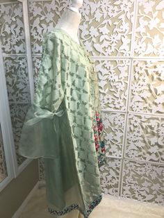 Very chic mint green jamawar on organza jacket, with bell sleeves and floral embroidery, it comes with silk matching inner, and ivory bell bottom. Brand: Bonita, Chen One Shipping USPS 2 day Green Floral Embroidery Raw Silk Sets, Spring Chanderi Sharara, Transitional Green Floral Embroidered Sets, Spring Tissue Silk Kurta With Resham Embroidery, Green Raw Silk Sets With Floral Embroidery, Spring Chikankari Embroidery Tissue Silk Kurta, Spring Kurta With Chikankari Embroidery In Tissue Silk, Spring Resham Embroidery Tissue Silk Kurta, Spring Designer Traditional Wear In Pista Green