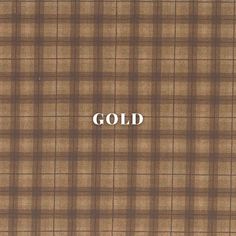 the word gold is written in white on a brown plaid background