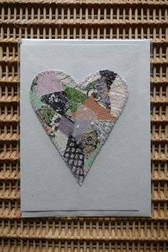 a card with a heart shaped patchwork design on it