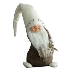 a stuffed gnome is sitting on the ground