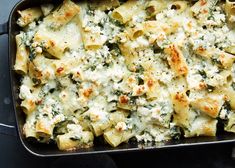 NYT Cooking: This baked pasta is inspired by spanakopita, the classic Greek spinach and feta pie. This loose interpretation combines pasta with gooey mozzarella, briny feta, plenty of greens and a rich cream sauce, which is then piled into a dish and baked until golden. The key to this dish is in the greens: Use at least three kinds — a mellow one, a peppery one and a fresh herb or two — to create an exciting Winter Pasta, Greek Spinach Pie, Feta Recipes, Nyt Cooking, Spinach And Feta, Vegetarian Dinner, Pasta Bake, Pasta Dishes, Pasta Recipes