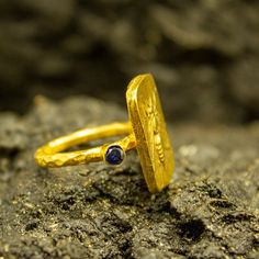 Roman Coin Ring | 24K Gold Plated | CZ Stone Silver Ring | Ionia Ephesus Coins Ring | Ancient Art Greek Silver Ring | Zeus Ring Our shop offer free ring sizing and color options.(Oxidized(Black),Gold Plated) Handcrafted hammered full round ring band size measures 2mm in width and 24k gold plated bronze coin 19x13 mm. Metal : 925 Sterling Silver Band Width : 2 mm Gem Stone : Navy Blue Diamond Cut Cubic Zirconia Gem Color : Green,Navy Blue,Purple,Blue,White,Red (The color you want is made for free Handmade Gold Sapphire Open Ring, Handmade Gold Open Sapphire Ring, Gold Sapphire Spiritual Promise Ring, Spiritual Gold Sapphire Promise Ring, 22k Gold Byzantine Style Rings As Gift, Handmade Gold Sapphire Ring For Anniversary, Hammered Jewelry, Roman Coins, Coin Ring