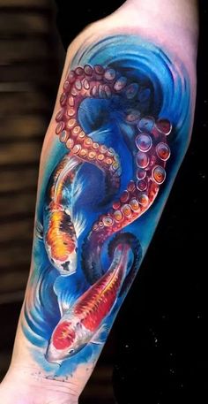 an octopus and fish tattoo on the arm