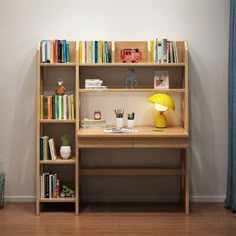 a wooden desk with books and toys on it