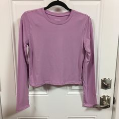 Wild Fable Long Sleeve Cropped T-Shirt Nwt Color = Lilac Streak Choose Size Measurements Approx Size Xsmall Pit To Pit = 16" Sleeve Length = 23 1/2" Back To Bottom Length = 17" Size Medium Pit To Pit = 17 1/2" Sleeve Length = 23 1/2" Back To Bottom Length = 18" All Items Come From A Smoke Free / Pet Free Home Purple Stretch Crew Neck Top, Fitted Long Sleeve Purple T-shirt, Spring Purple Crew Neck Top, Purple Crew Neck Top For Spring, Basic Long Sleeve Purple Top, Basic Purple Long Sleeve Top, Purple Plain Crew Neck Top, Plain Purple Top For Spring, Purple Fitted Long Sleeve T-shirt