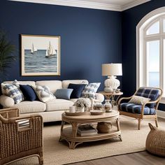 a living room with blue walls and white furniture in it, along with two wicker chairs