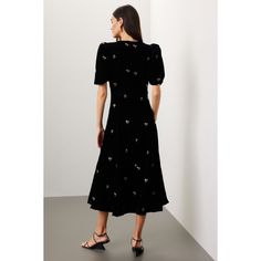 Black velvet (97% viscose, 3% elastane). A-line. Short sleeves. Crewneck. Back zipper closure. 49.5" from shoulder to hemline. Imported. Fitted Velvet Midi Dress With V-neck, Fitted Viscose A-line Midi Dress, Fitted Velvet V-neck Midi Dress, Formal Midi-length Velvet Dress, Velvet A-line Cocktail Dress, Chic Knee-length Velvet Dress, Cocktail Velvet Midi Dress, Chic Fitted Velvet Midi Dress, Evening A-line Velvet Dress