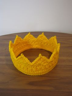 The Everyday Crown is a handmade unisex crochet crown made for all purposes:  festivals, birthdays, dress up, Halloween costumes, and random Tuesdays when the people in your life need a reminder of how royal you are!  This made-to-order item can be made in adult or childrens' sizes, and features a decoratively stitched base, sunray points (7 for adult sizes, 5 or 6 for childrens' sizes).  This coronet is made with a bright gold acrylic yarn that is stiff enough to hold the royal shape, but soft enough for comfort.  Conveniently, this diadem can be folded and put in your pocket for when you need to duck the paparazzi.  Also machine washable because...life. This forms a great base to further glamorize by adding various jewels and sparkles available at your favorite craft or bead store. Other Birthdays Dress, Unisex Crochet, Up Halloween Costumes, Crochet Crown, Dress Up Halloween, Up Halloween, Bead Store, Bright Gold, Adult Costumes