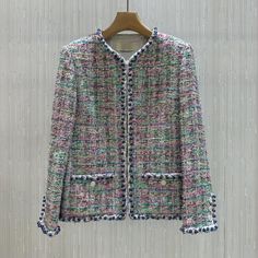 This Beads Tweed Jacket adds an elegant touch to any outfit with its intricate beaded design. Made from quality tweed fabric, it is versatile enough to be worn for both casual and formal occasions. Elevate your style with this timeless piece. One Size (Fits XS-M) Chest 50cm Body Length 63cm Nylon 10% Polyester 90%  Dry Clean Luxury Tweed Outerwear For Spring, Luxury Tweed Jacket For Spring, Elegant Embellished Tweed Dress For Spring, Elegant Multicolor Winter Blazer, Luxury Long Sleeve Tweed Jacket For Spring, Elegant Multicolor Blazer For Fall, Elegant Multicolor Fall Blazer, Tweed Jackets, Tweed Fabric