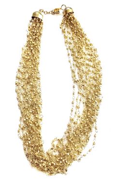 "Layered GOLD Beaded necklace perfect for the upcoming holiday parties ** Multi strand fine beaded Necklace ** hand beaded jewelry ** Length of Necklace is 18 inches ** Perfect on a Little Black Dress or even a T-shirt. ** Make a statement this thanksgiving or be the spice of the Christmas party. This beautiful necklace would make a great Holiday Gift for someone special. All Items come carefully gift wrapped in branded boxes or bags. A complimentary message can be included on request. PRESS: \" Multi-strand Gold Jewelry For Celebration, Beaded Layered Necklace For Party With Round Beads, Beaded Layered Necklace With Round Beads For Party, Beaded Layered Necklace For Party, Elegant Gold Beaded Chain Necklace For Party, Beaded Choker Chain Necklace For Party, Party Beaded Choker Chain Necklace, Elegant Party Chain Necklace With Colorful Beads, Gold Beaded Bohemian Necklaces