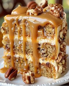 a piece of cake with caramel drizzled on top and pecans