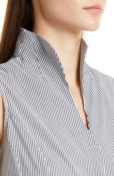 Modern polish defines this stretch-woven blouse designed in a sleeveless silhouette with classic pinstripes. Split collar 65% cotton, 32% nylon, 3% spandex Machine wash, line dry Imported Pinstripe Sleeveless Tops For Work, Chic Pinstripe Tops For Work, Pinstripe Cotton Business Tops, Pinstripe Sleeveless Top For Spring, Sleeveless Pinstripe Tops For Work, Sleeveless Pinstripe Tops For Summer, Classic Pinstripe Blouse For Summer, Vertical Stripes Summer Office Tops, Vertical Stripes Top For Work