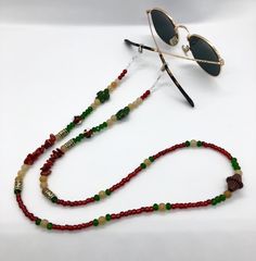 Whether you're headed to a festival, taking a stroll along the beach, or just walking around the block, these sunglass chains are both handy and stylish to bring along for the ride. Convenient if you want to let your glasses hang comfortably on your chest, or put them on to add some flair to any activity you're getting into. Elastic endpieces stretch out and make it easy to slide the chain onto any pair of sunglasses or reading glasses. Each pair is handmade with love in colorful Colorado :) Custom designs are welcome, let me know what you have in mind and I'd love to make it happen! **Photos 3 & 4 are just examples of what they look like on, not necessarily the exact same pair you're looking at. Bohemian Sunglasses With Uv Protection For Vacation, Multicolor Glass Sunglasses As Gift, Handmade Sunglasses For Summer Gift, Festival Sunglasses With Uv Protection And Adjustable Fit, Adjustable Festival Sunglasses With Uv Protection, Adjustable Uv Protection Sunglasses For Festivals, Trendy Gold Glasses Chains For The Beach, Multicolor Glass Sunglasses For Festivals, Gradient Glass Sunglasses As A Gift