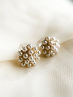 ✿  Pearl Cluster Gold Stud Earrings ✿ Made of 18k gold filled metal and tiny authentic polished pearls, posts are 925 sterling metal. These are a customer favorite because they can be worn with both the simplest and fanciest of outfits and blend with whatever your attire. love, love these pearl cluster studs!  Backings are push backs.  Hypoallergenic, lead free, nickel free. Great for people with sensitive ears! Handmade in my home studio in Brookings, SD. Pearl White Clip-on Earrings For Wedding, Elegant Pearl Button Earrings For Wedding, Pearl White Pearl Clip-on Earrings For Wedding, Pearl White Cluster Earrings For Wedding, White Pearl Cluster Earrings For Wedding, White Clip-on Pearl Earrings For Wedding, White Clip-on Cluster Earrings For Wedding, Round Pearl Charm Bridal Earrings For Wedding, White Cluster Clip-on Earrings For Wedding