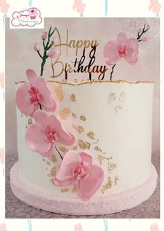 a birthday cake with pink flowers on it