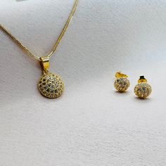 22k solid gold earrings and pendant charm only. Charm - approximately 1.25 grams in weight, 10.2mm diameter, 16.8mm height including the hook - UK 916 hallmark Earrings - 1.34 grams in weight, 6.5mm diameter, 14.8mm post length. Earrings come with push back closure. Our 22k jewelleries are genuine real gold. Each item is packaged in our branded packaging, so your order is ready to be gifted.  All items are ready to be shipped within 2 working days through tracked post unless otherwise stated. Fo Gold Necklaces With Matching Earrings And Round Pendant, Gold Jewelry Sets With Round Pendant For Gift, Gold Jewelry Sets With Matching Earrings Pendant, Gold Jewelry Sets With Matching Pendant Earrings, 22k Gold Round Hallmarked Jewelry Sets, Hallmarked 22k Gold Round Jewelry Sets, Gold Pendant Earrings With Cubic Zirconia, Gold Cubic Zirconia Pendant Earrings, Gold Fine Jewelry Sets With Matching Earrings