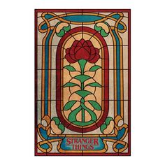 a stained glass window with the words strange things written on it and a rose in the center