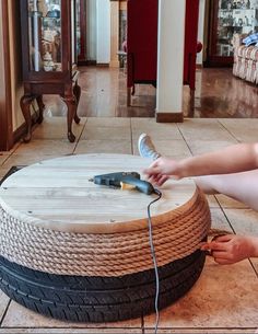 a person is using an electric tool to attach a tire