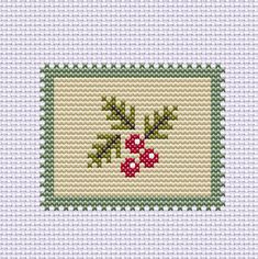 a cross stitch pattern with holly leaves and berries on the side, in green and white