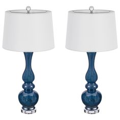 two blue lamps with white shades on them