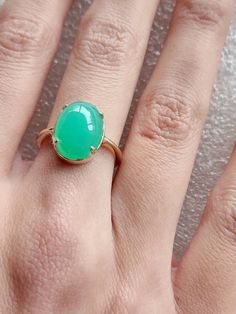 Chrysoprase ring in 10 carat yellow gold, quality green Chrysoprase ring, oval cabochon Chrysoprase ring The Chrysoprase measures 14x10mms and weighs 5.4 carats The ring is in 10 carat yellow gold Ring size is M (Australian size) or 7 1/4 (US size). Ring is ready to ship in 1-2 working days.  We resize free of charge.  Please allow a couple of additional days for resizing. All my rings come in a velvet ring box.  I am highly conscious of environmental damage that extra packaging can create so my Oval Cabochon Emerald Ring For May Birthstone, Green Oval Turquoise Gemstone Ring, Chrysoprase Emerald Ring With Oval Cabochon For Gift, Yellow Gold Emerald Chrysoprase Cabochon Ring, Oval Green Chalcedony Rings, Green Oval Chalcedony Rings, Green Emerald Oval Cabochon Ring, Green Emerald Ring With Oval Cabochon, Classic Green Cabochon Emerald Ring