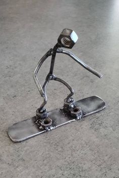 a metal figure is standing on a skateboard