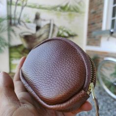 Ideal for quick trips or outdoor activity, our Zip Leather Coin Purse is for those who like to keep things simple and only need to carry the essentials. Handmade by leather artisans on Lake Atitlan, the zip coin purse is constructed with a golden YKK zipper attached with a hand-stitched leather puller to facilitate opening. The full-grain pebbled black leather develops a smooth, much-desired patina with use. Specs Length: 4.5´´ Height: 3.5´´ Depth: 1.0''Material: Full-grain bovine leather Brown Leather Coin Purse With Zipper Closure, Brown Leather Coin Purse, Leather Coin Purse In Pouch Shape, Leather Coin Purse With Zipper For Everyday Use, Everyday Leather Coin Purse With Zipper, Leather Coin Purse With Zipper Closure For Everyday Use, Brown Leather Coin Purse With Zipper Pocket, Daily Use Leather Coin Purse With Zipper, Brown Travel Coin Purse