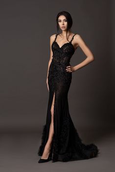 Craftes from black mesh and adorned with delicate lace, this elegant formal gown showcases a Sheath silhouette that reflects countless hours of meticulous handwork. Every intricate detail, from the lace to the pearls, is meticulously sewn by hand, creating a true work of art. The gown boasts a seductive open back, alluring straps, and a graceful train adorned with feather accents, ensuring a show-stopping and unforgettable presence. Dresses Long Black, Formal Evening Dresses Long, Nontraditional Bride, Formal Dress For Women, Black Dresses For Women, Black Formal Gown, Black Lace Gown, Black Gowns, Gown Floral