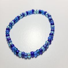 Get ready to add a pop of sweet style with our Blueberry Stretch Bracelet! This stretchy bracelet features delightful small beads in various shades of blue, resembling a tasty blueberry. Easily dress up any outfit with this fun and playful accessory. Blue Stretch Bracelet With Colorful Beads, Blue Trendy Hypoallergenic Friendship Bracelet, Trendy Blue Hypoallergenic Friendship Bracelets, Trendy Blue Hypoallergenic Friendship Bracelet, Blue Beaded Stretch Bracelet, Blue Beaded Flexible Stretch Bracelet, Light Blue Beaded Bracelets With Round Beads, Trendy Blue Stretch Bracelet With Spacer Beads, Flexible Blue Beaded Stretch Bracelet