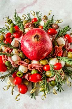 an apple surrounded by various vegetables and fruits