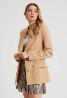 A rockstar blazer meets pure sophistication in this women's designer light camel blazer. This piece has a luxe peak lapel, functional buttoned front and generously padded shoulders that will enhance any outfit. Add this classic piece to your wardrobe revamp for next time you're dressing up for that big promotion at work or heading out on the town Product Features - Pure sophistication written all over it - Comes with luxe peak lapels and functional buttonfront - Padded shoulder adds comfort, sup Beige Double-breasted Blazer With Suit Collar, Beige Office Blazer With Button Closure, Trendy Double-breasted Formal Blazer, Classic Beige Double-breasted Blazer, Trendy Business Blazer With Hidden Button Closure, Beige Office Blazer With Lapel Collar, Chic Beige Blazer With Suit Collar, Chic Beige Blazer For Business, Neutral Suit Collar Blazer For Work