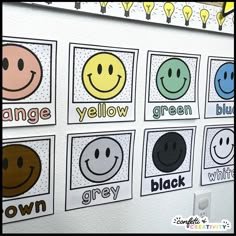 a bulletin board with different smiley faces on it and the words orange, yellow, green, grey, black