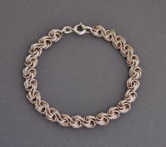 Art deco era 835 silver Garibaldi chain bracelet. Length 18 cm (7.1"), Width 0.7 cm (0.3") Weight 9.7 grams Hallmarked: 835 for European silver Very good vintage condition Will be delivered by tracked mail. Thank you for looking. Please see my other items. Formal Silver Box Chain Bracelet, Silver Oval Link Box Chain Bracelet, Formal Sterling Silver Link Bracelet With Chain Detail, Formal Sterling Silver Link Bracelet, Silver Chain Link Bracelet For Formal Occasions, Formal Silver Chain Link Bracelet, Vintage White Gold Chain Bracelet For Formal Occasions, Formal Silver Chain Bracelet, Hallmarked Silver Metal Chain Bracelet