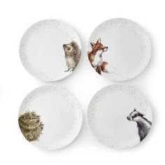 four plates with animals painted on them